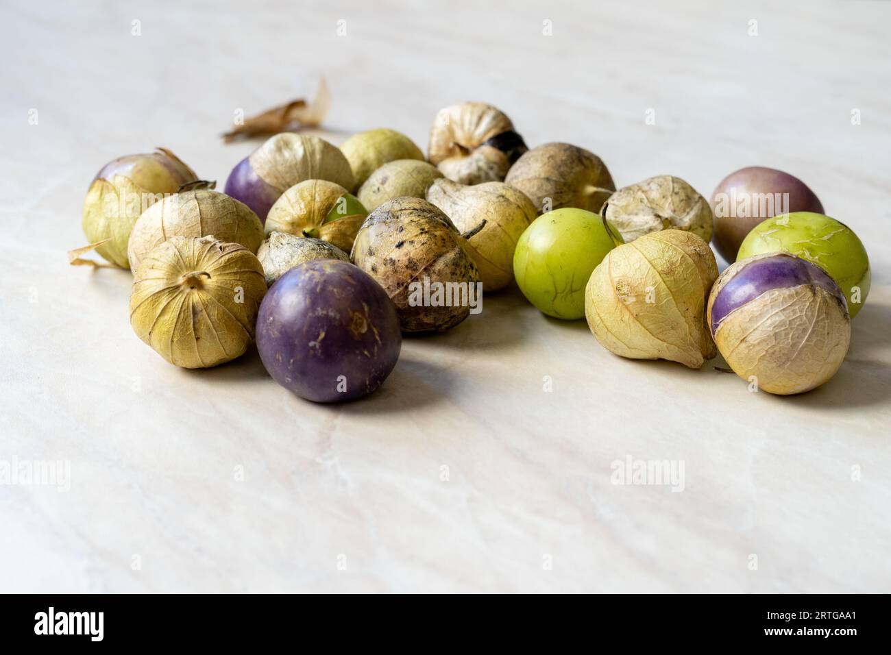 Tomatillos, green tomatoes, with salsa verde, green sauce, in a