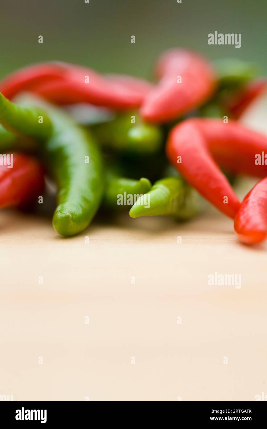 Red and green chili peppers Stock Photo - Alamy