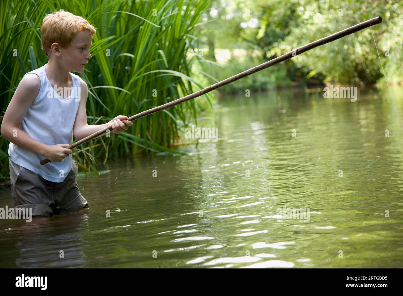 Blonde boy fishing hi-res stock photography and images - Alamy