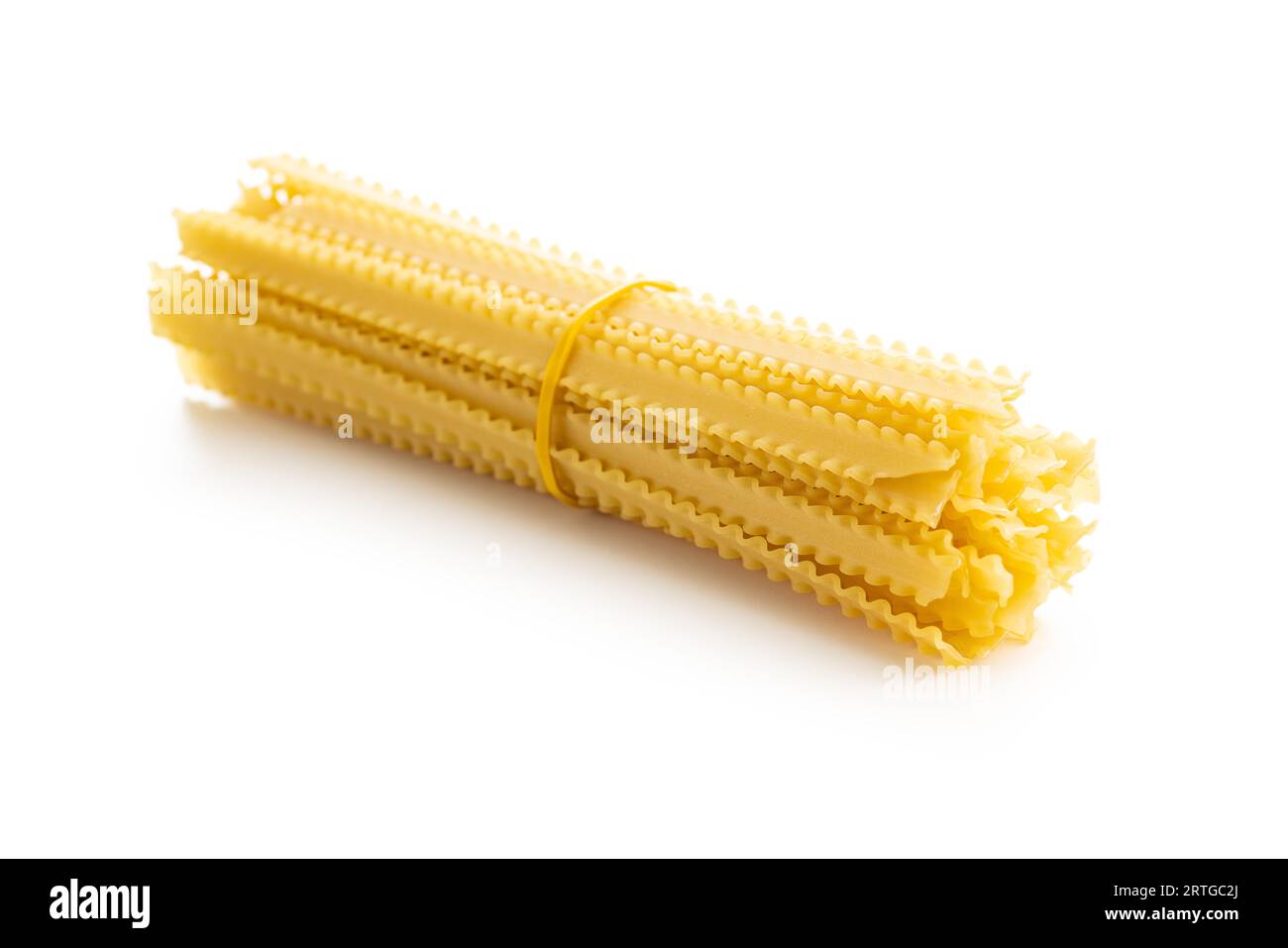 Uncooked mafaldine pasta. Raw long mafalda pasta isolated on the white