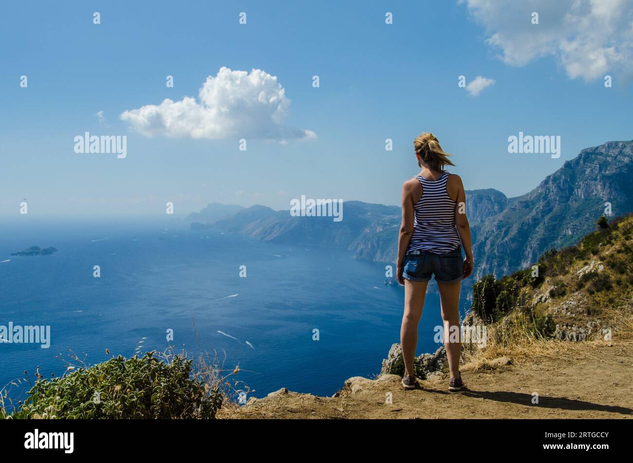 Girl looking Positano and sea from the Path of the Gods on the Amalfi coast Stock Photo