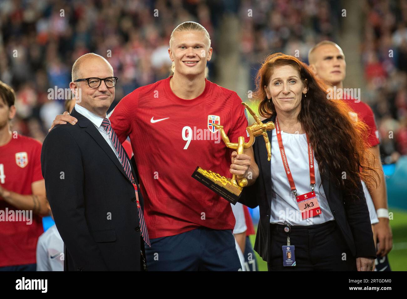 Oslo, Norway. 12th Sep, 2023. Erling Haaland (9) of Norway receives the UEFA Nations League top scorer award 2022/23 before the UEFA Euro 2024 qualification match between Norway and Georgia at Ullevaal Stadion in Oslo. Here Haaland is seen with NFF president Lise Klaveness (R) and NFF general secretary Karl-Petter Loken (L).(Photo Credit: Gonzales Photo/Alamy Live News Stock Photo