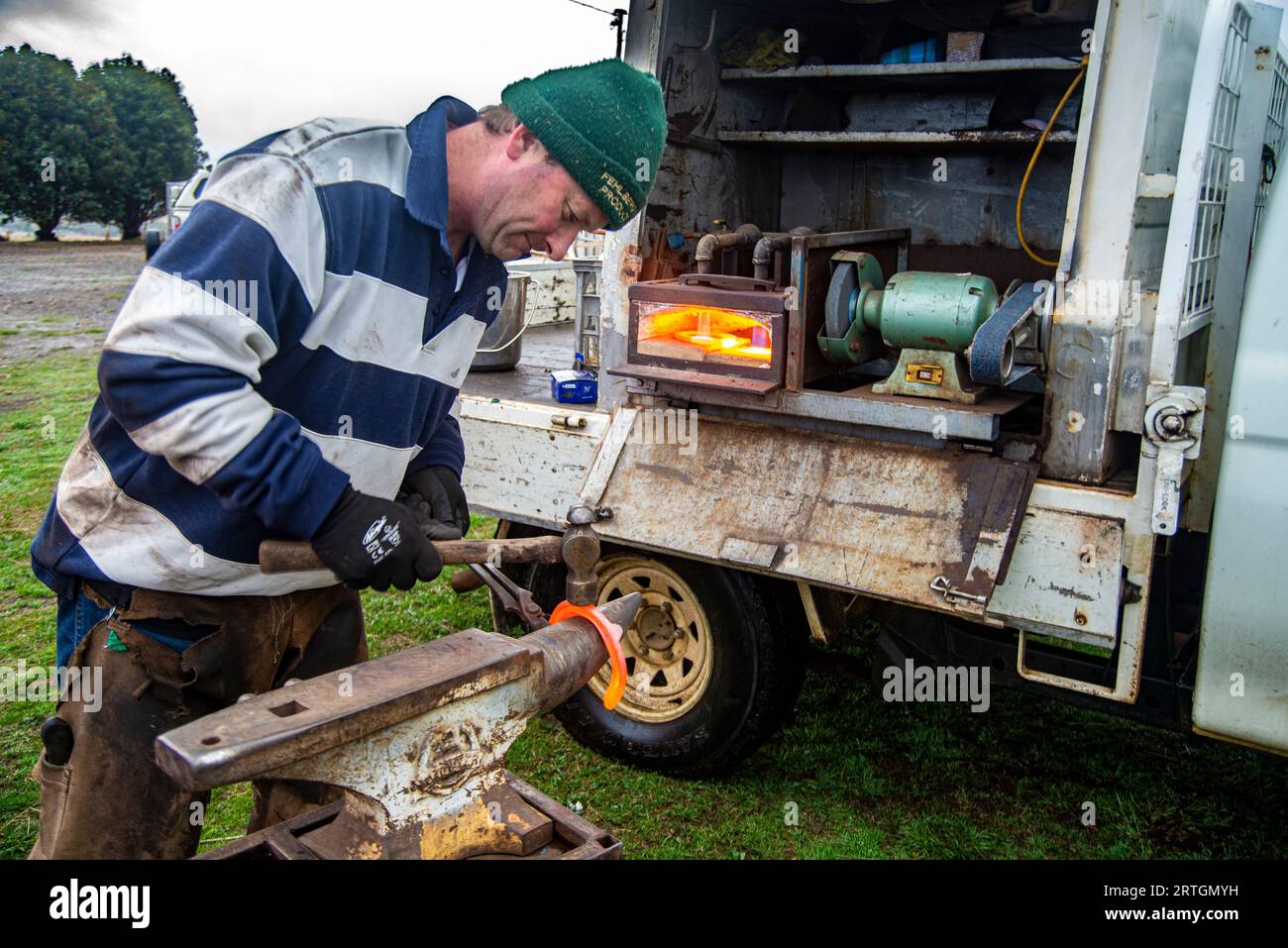 Horse farrier, Craig Robottom using a portable anvil and mobile truck
