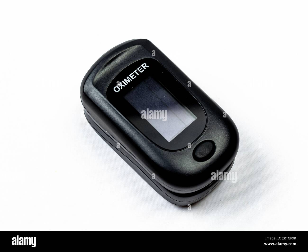 Digital pulse oximeter photographed on a white background in high key. Medical instruments. Stock Photo