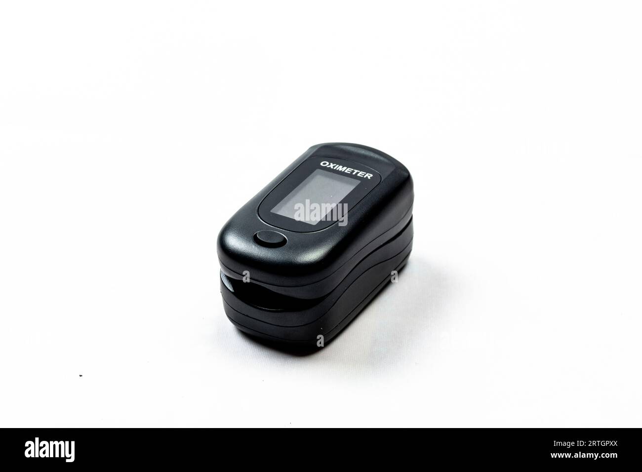Digital pulse oximeter photographed on a white background in high key. Medical instruments. Stock Photo