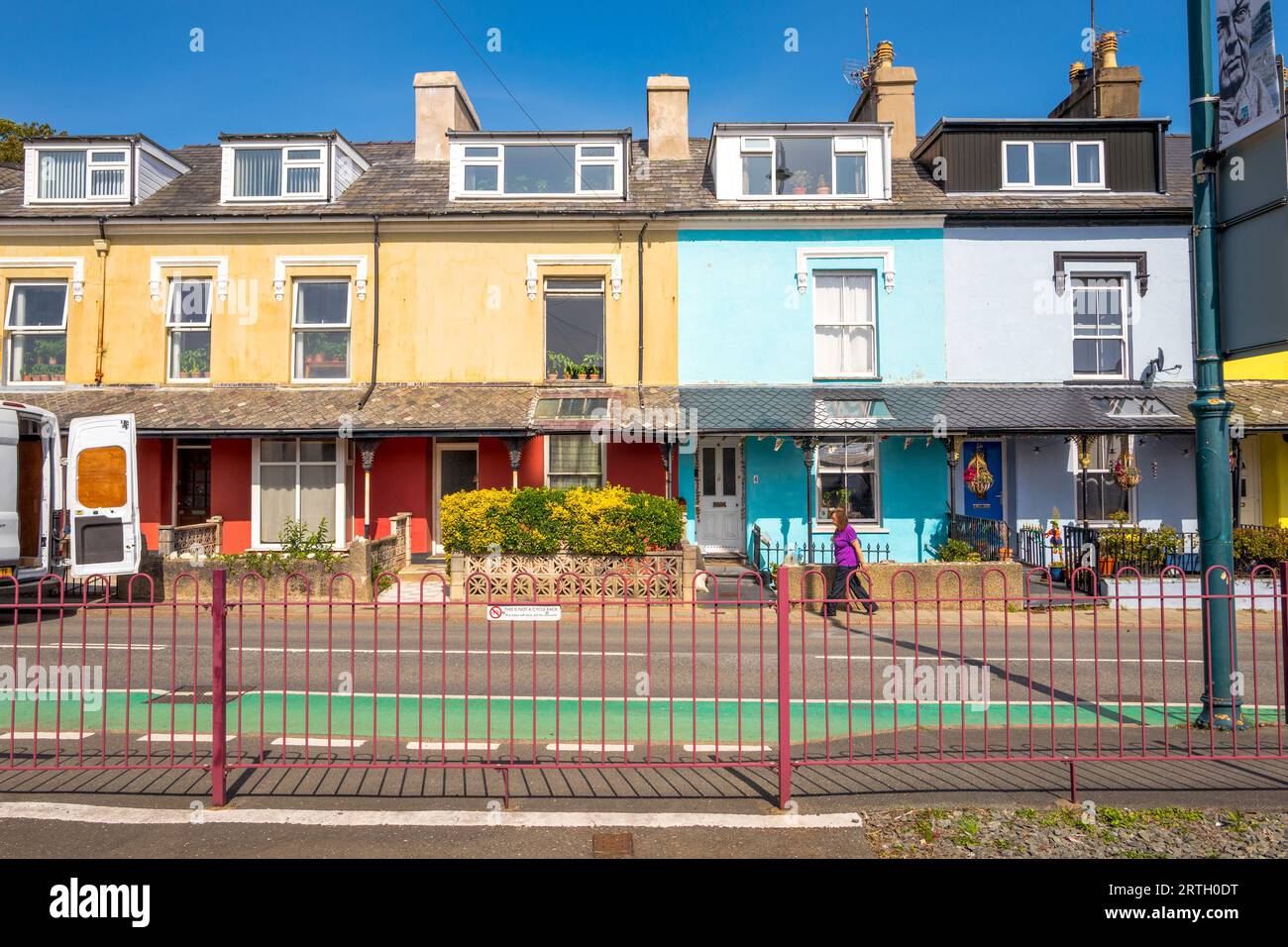 Row of pastel coloured terraced housing on the high street at Portmadoc, Gwynedd, Wales. Stock Photo