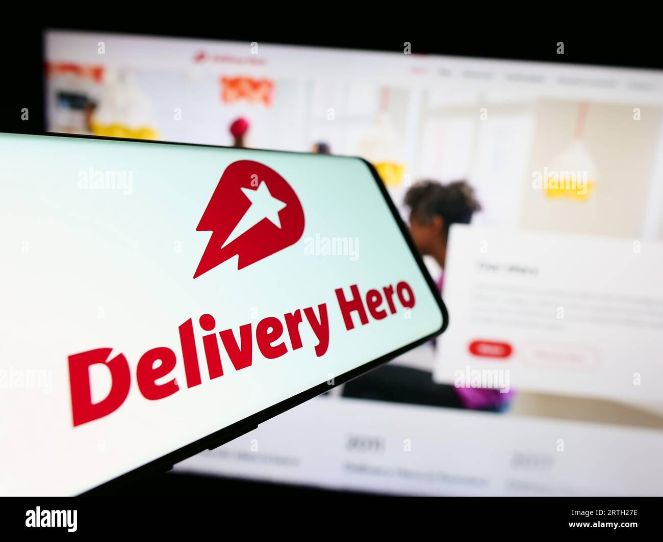 Mobile phone with logo of German food ordering company Delivery Hero SE