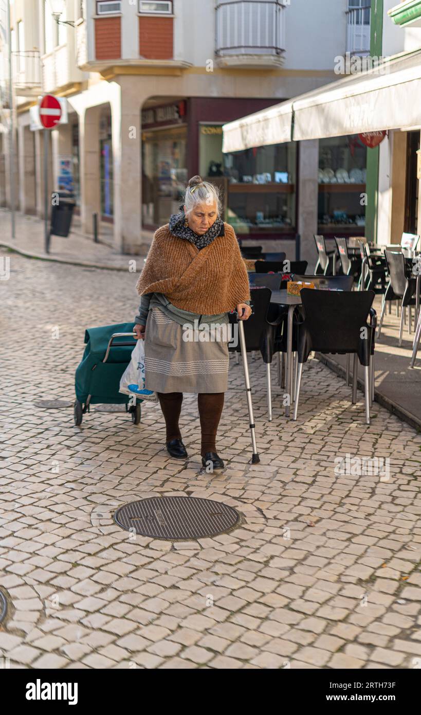 Old lady standing on street hi-res stock photography and images - Alamy