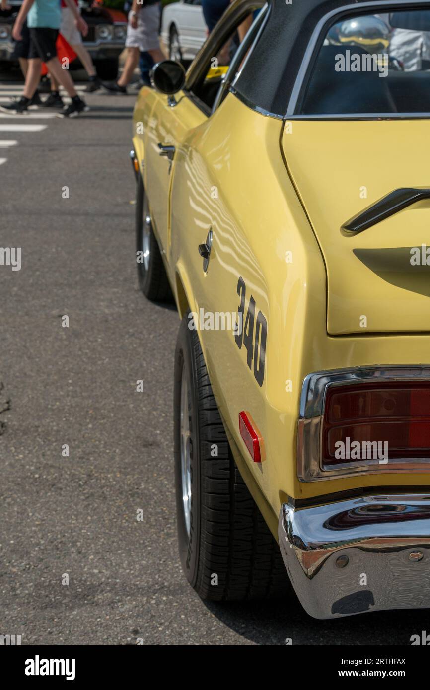 A yellow Plymouth Duster car parked on a street in Manchester, the United States Stock Photo