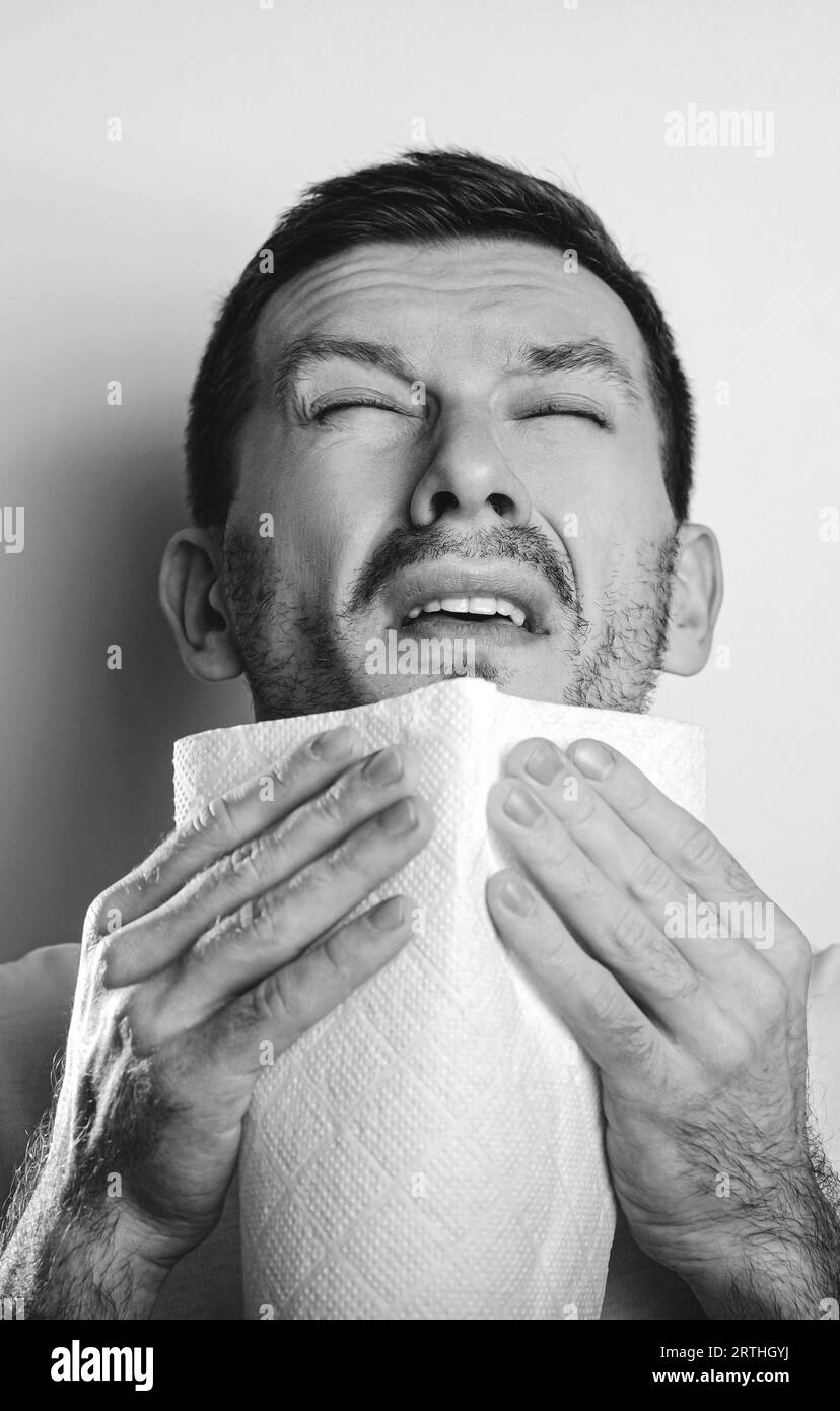 Sick guy has runny nose. man Stock Photo