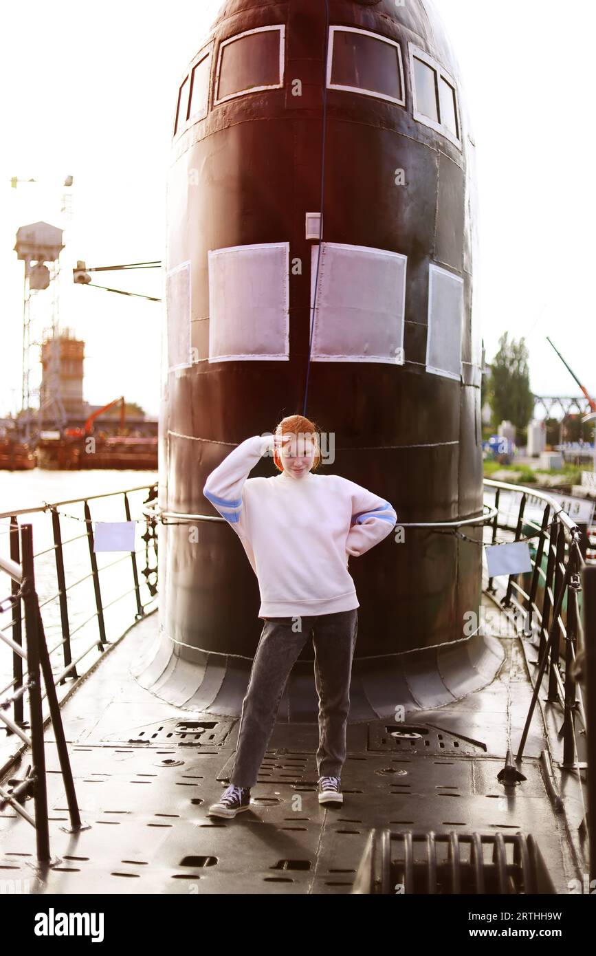 teenager visits a submarine with excursion Stock Photo