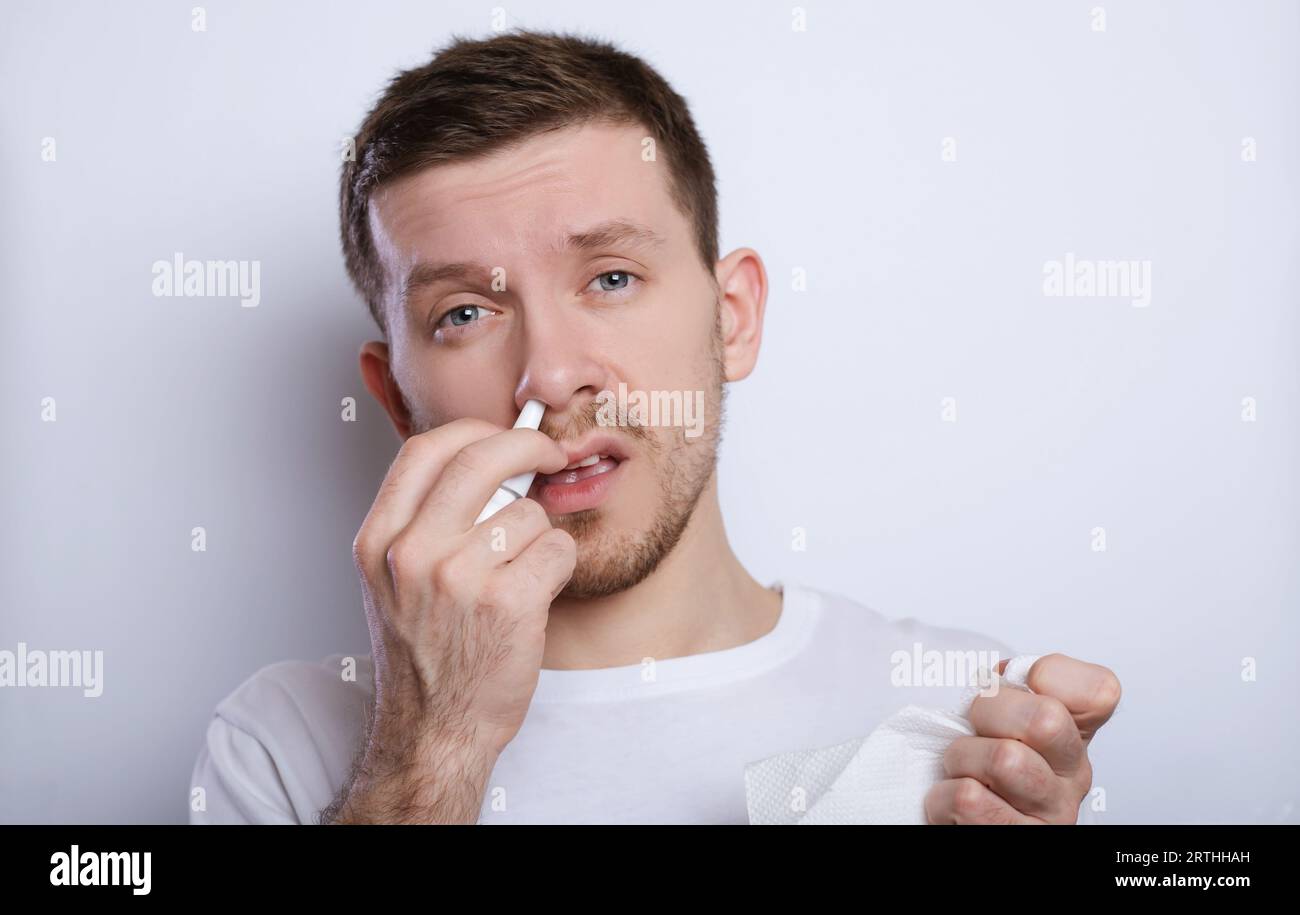 Sick guy has runny nose. man Stock Photo Alamy