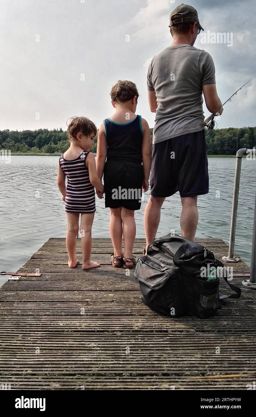 Father goes fishing with children Stock Photo