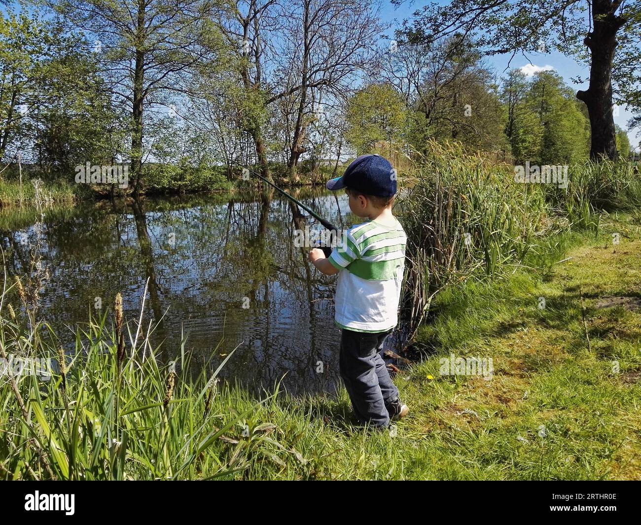 Little boy fishing hi-res stock photography and images - Alamy