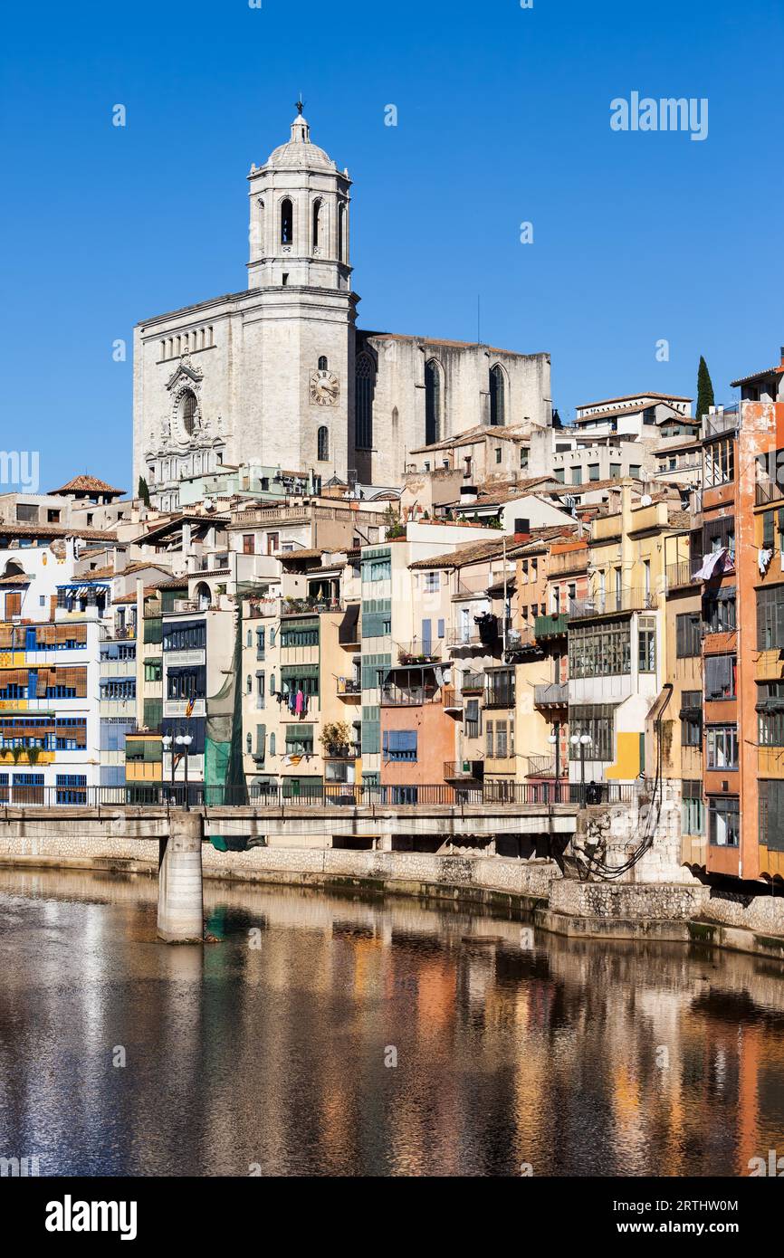 Girona city in Catalonia, Spain, Old Quarter (Barri Vell) houses at River Onyar and Cathedral of Saint Mary of Girona above Stock Photo