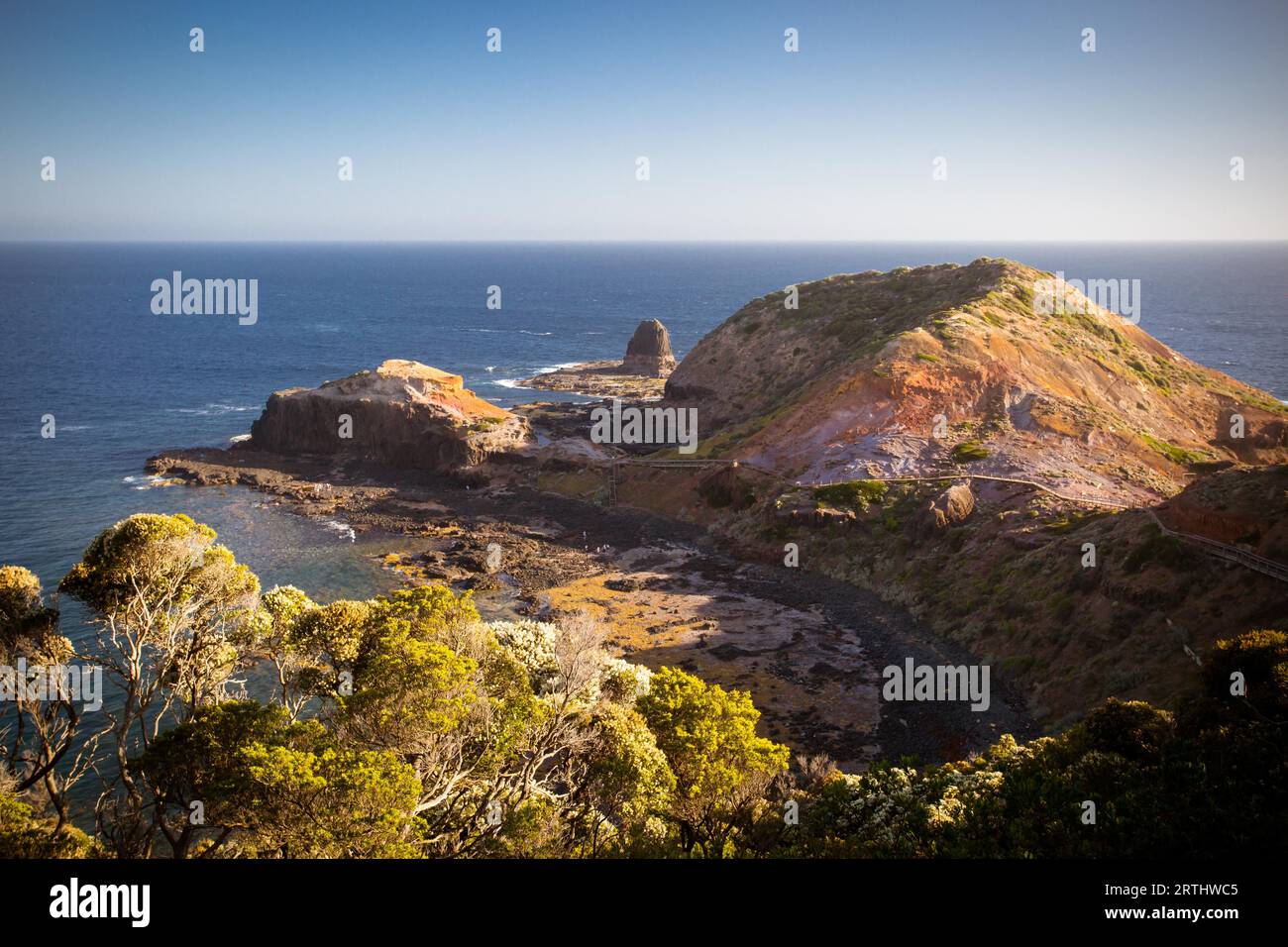 The famous Cape Schanck boardwalk runs towards the sea and rock formation known as London Bridge, in Victora. Australia Stock Photo