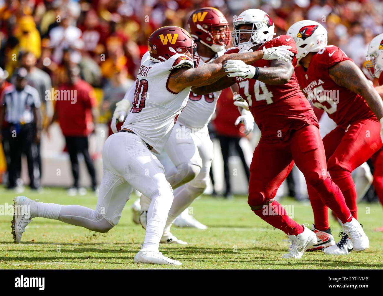 Washington Commanders DE Montez Sweat (90) shoving back Cardinals 