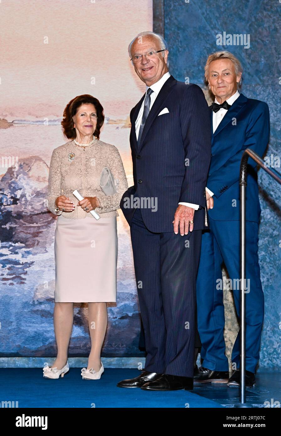 STOCKHOLM 20230913 King Carl Gustaf, Queen Silvia, and Swedish artist Lars Lerin at a reception at the Royal Palace in Stockholm where a gift from the parliament and government was handed over to the King, who celebrates 50 years on the throne. The gift is an eight-square meter fabric made after a watercolor painting by Swedish artist Lars Lerin. Frida Lindberg has been artistic director and weavers have been Ebba Bergström and Tova Vibrandt.  Photo: Jonas Ekstromer / TT / code 10030 Stock Photo