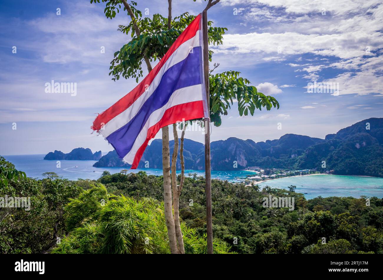 View of beautiful Ko Phi Phi Don island from Viewpoint 3 with waving Thailand flag Stock Photo