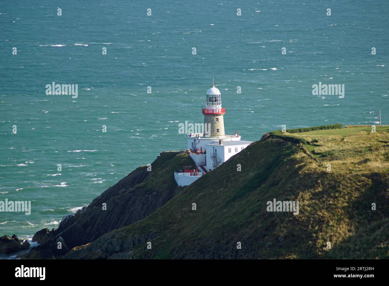 The town of Howth is located on the peninsula Howth Head directly opposite the Dublin district of Sutton and is connected to the mainland via a dam. Stock Photo