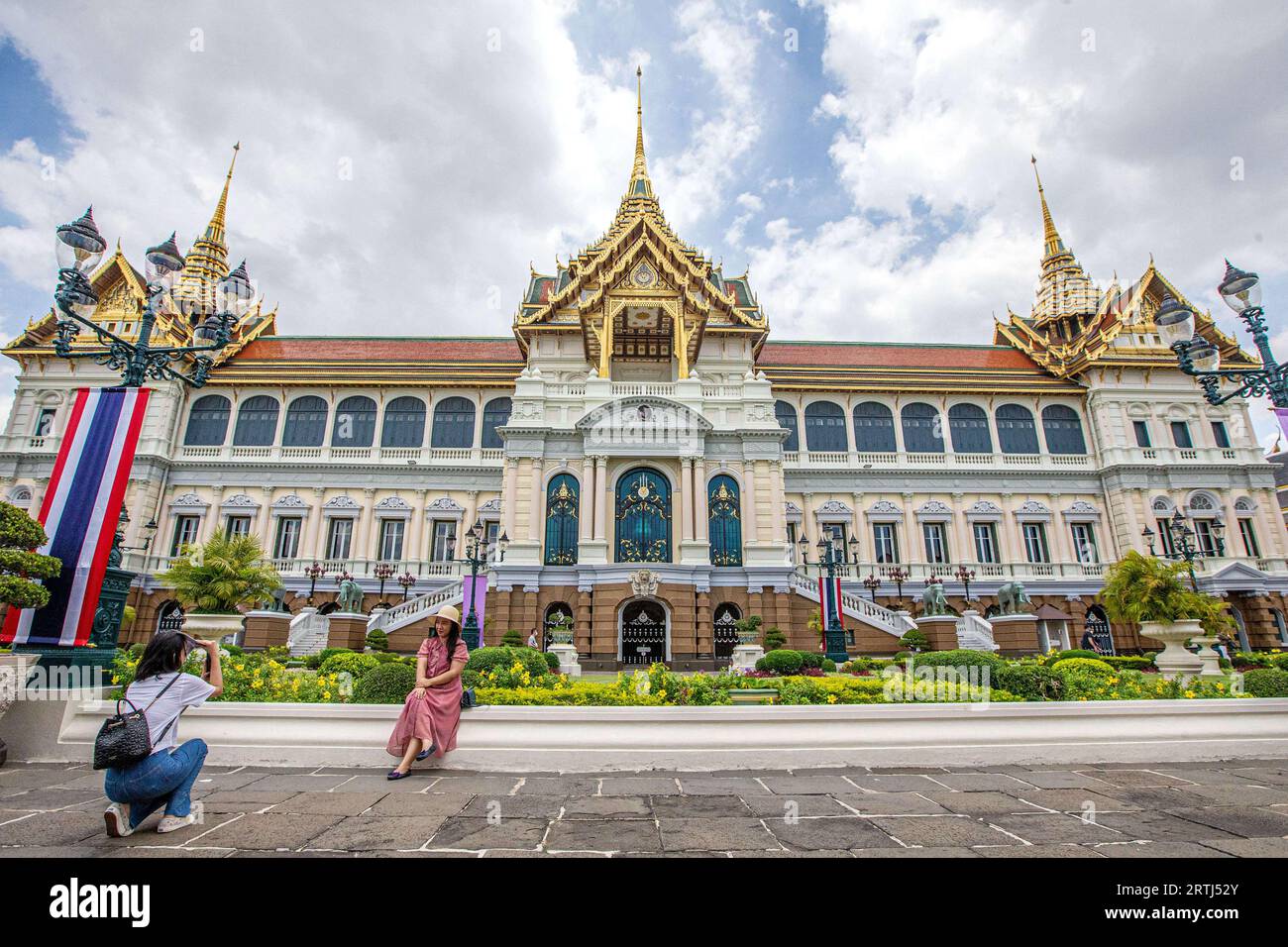 Bangkok, Thailand. 15th June, 2023. Tourists take photos at the Grand Palace scenic spot in Bangkok, Thailand, June 15, 2023. Thailand has approved a temporary visa waiver for visitors from China and Kazakhstan during the year-end high season in support of its vital tourism industry. Credit: Wang Teng/Xinhua/Alamy Live News Stock Photo