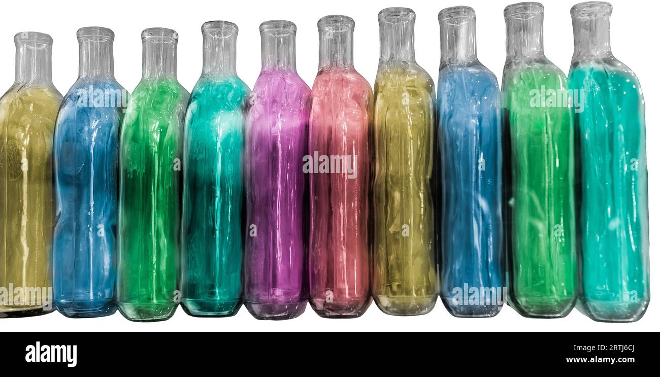 Large group of empty colored recycled glass bottles on white isolated background Stock Photo