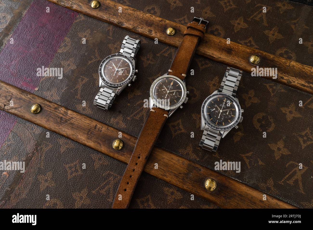 Vintage Omega Speedmaster shoot on top of an old riveted Louis Vuitton  travel case with it's iconic LV pattern Stock Photo - Alamy