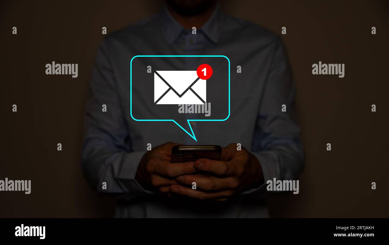 Hand of businessman touching new email notification for business e-mail communication and digital marketing. Inbox receiving electronic message alert. Stock Photo