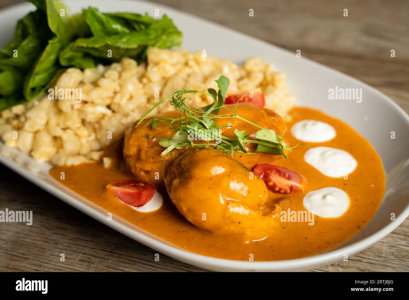 Chicken with paprika sauce, Hungarian galuska with egg and sour cream