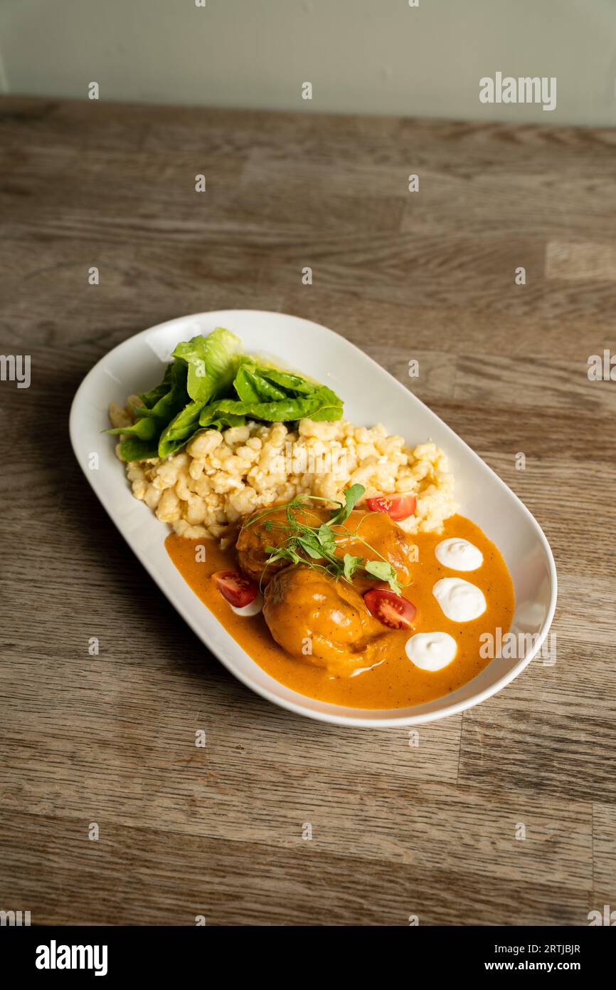 Chicken with paprika sauce, Hungarian galuska with egg and sour cream