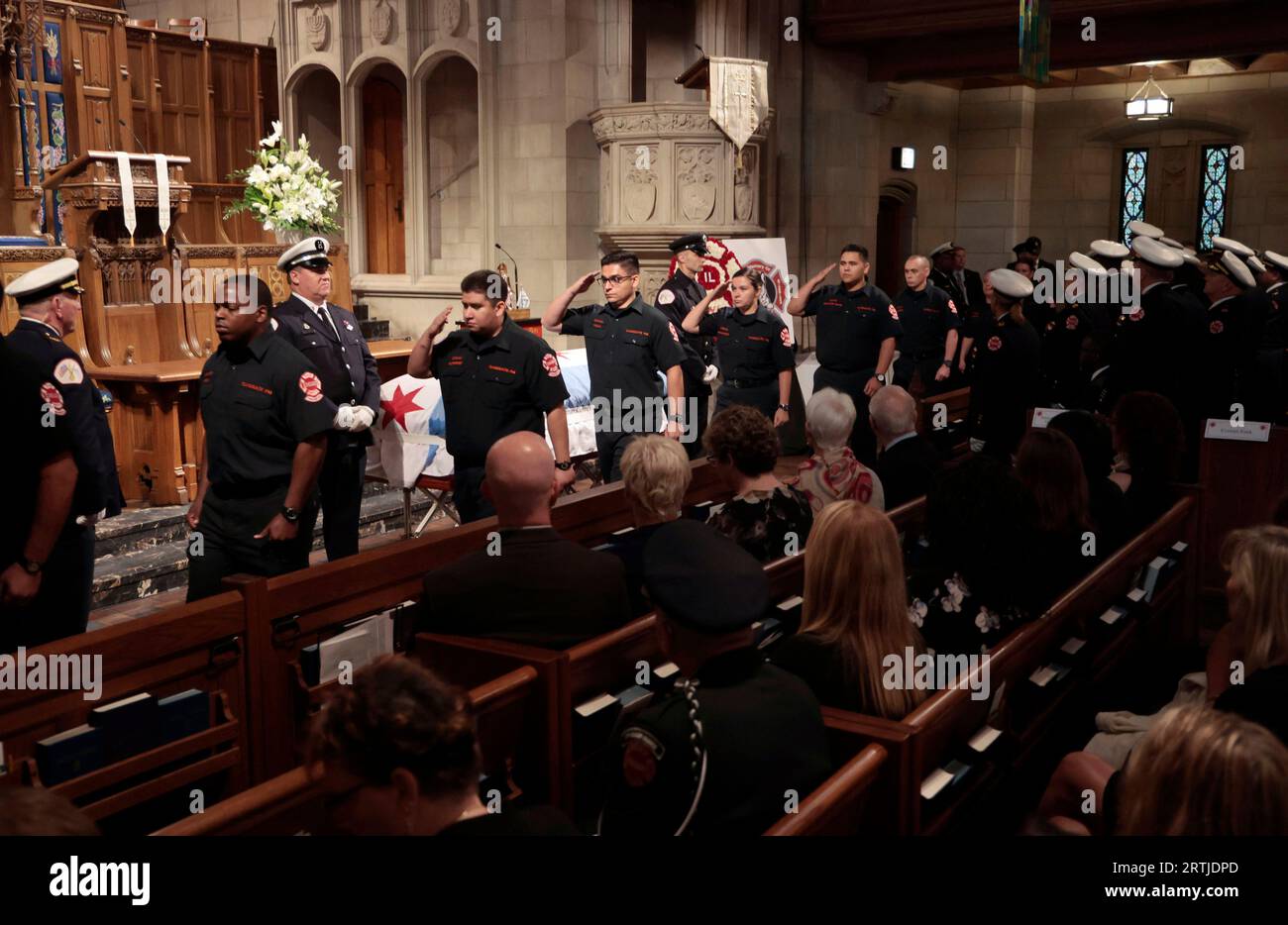 Firefighters conduct a walk through during the visitation and funeral