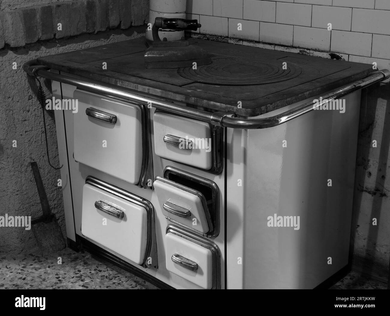 old economical cast iron stove for heating the house using firewood