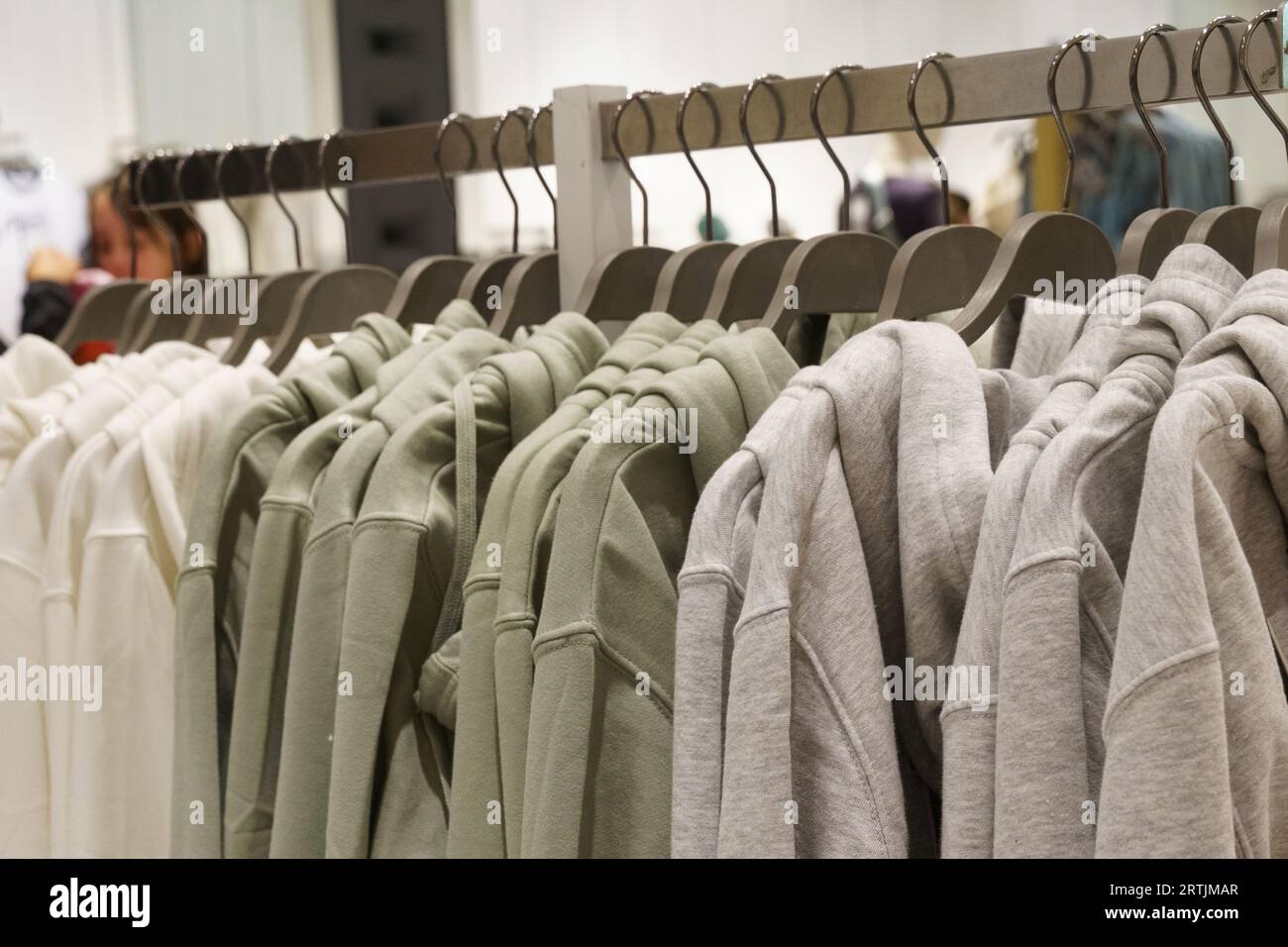 Premium Photo  Row of colorful clothes on hangers in pastel