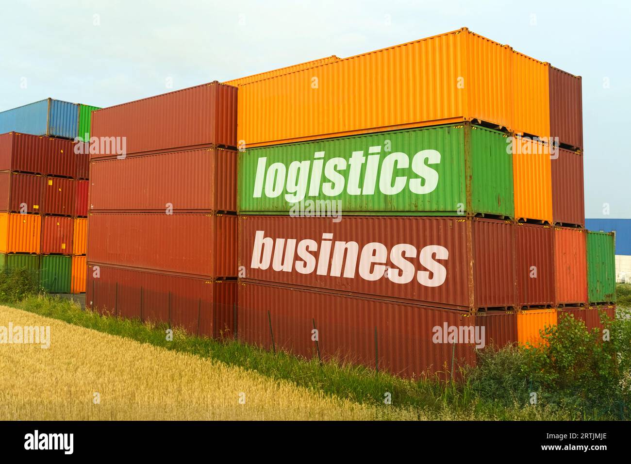 Business concept. On colored containers for the carriage of goods, the inscription - logistics business Stock Photo