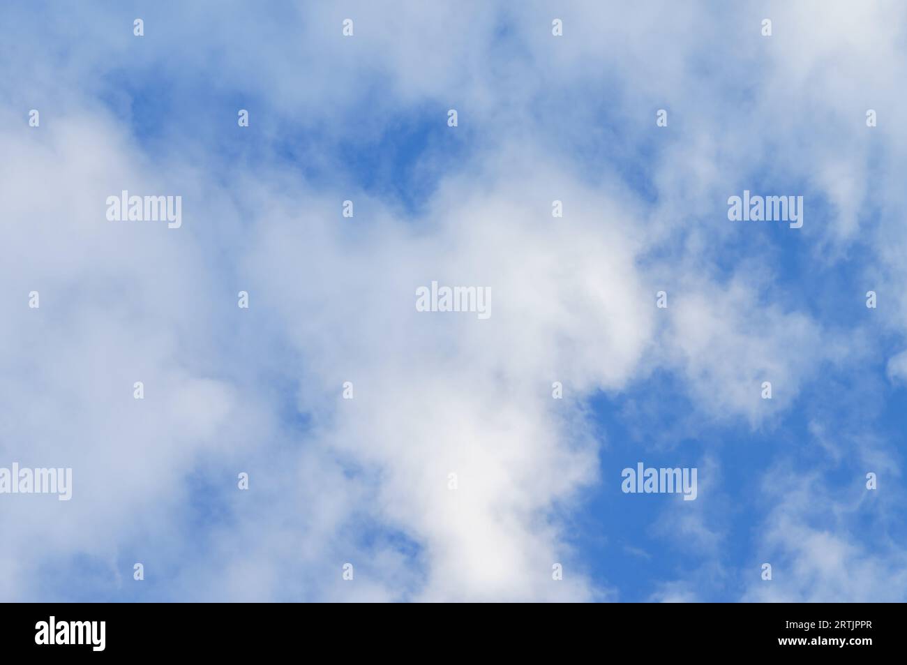 Blue sky and clouds. The sky with clouds. White clouds in the blue sky. Stock Photo