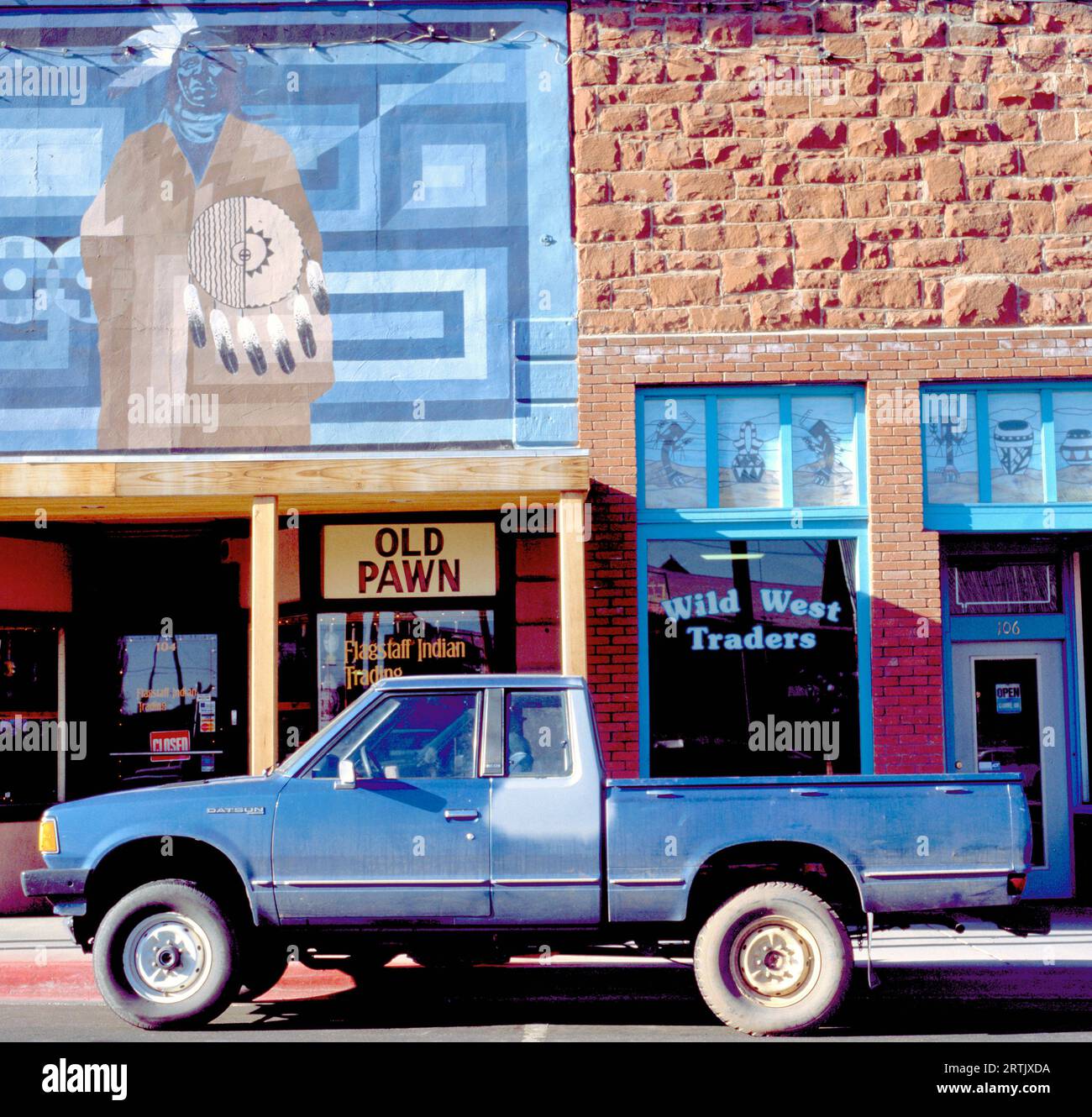 FLAGSTAFF, USA- NOVEMBER 15, 2014 Car parked in front of the Old Pawn shop, an Indian trading post. A trading post was an establishment where the trad Stock Photo
