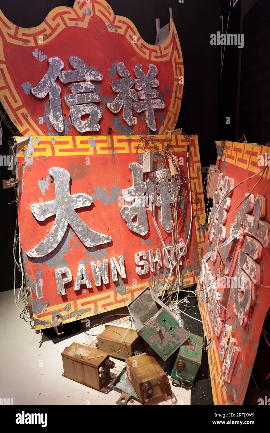 Old dismantled pawn shop neon light advertising sign that had been taken down and removed from a shop. Hong Kong - 26th August 2023 Stock Photo
