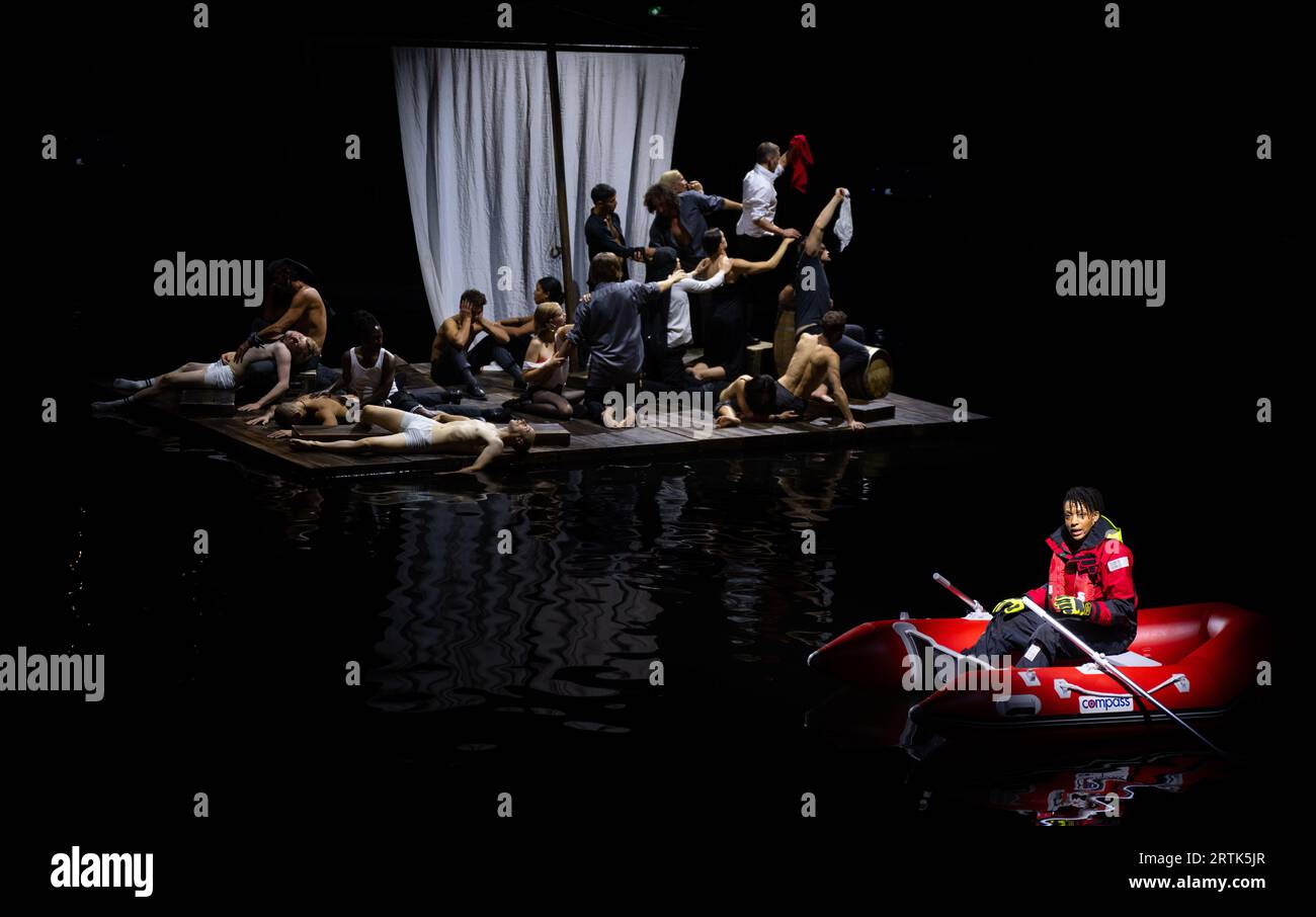 Berlin, Germany. 13th Sep, 2023. Iduna Münch (r) as Charon and members of the ensemble perform during the photo rehearsal of the opera 'The Raft of Medusa' in Hangar 1 on the grounds of the former Tempelhof Airport. The piece will premiere on September 16, 2023. Credit: Monika Skolimowska/dpa/Alamy Live News Stock Photo