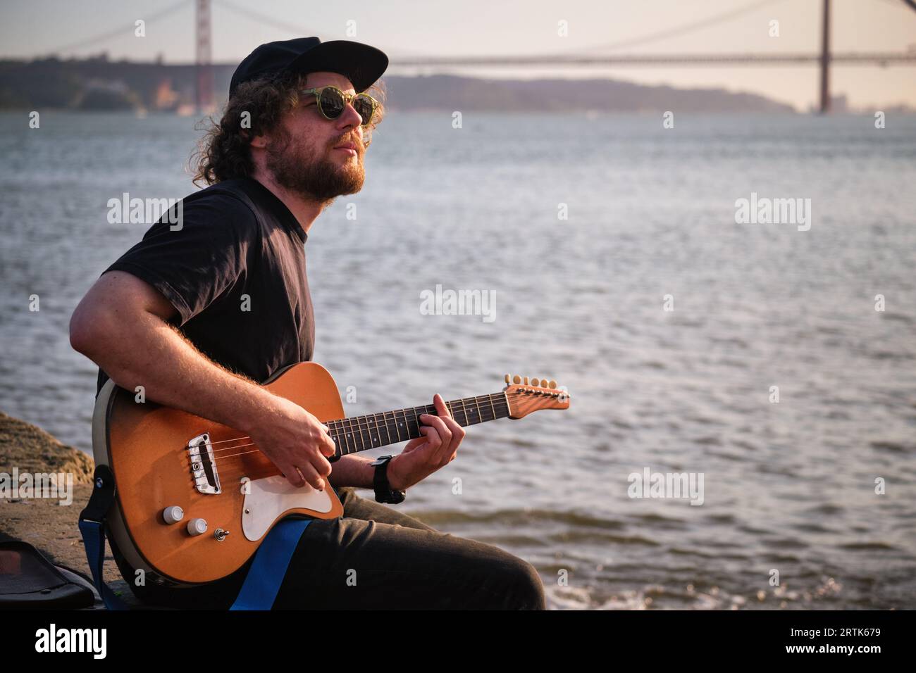 Street musician playing electric guitar in the street Stock Photo - Alamy