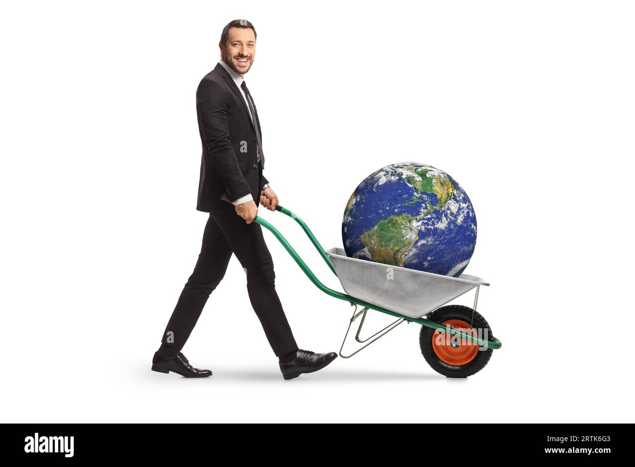 Businessman pushing a wheelbarrow with the plant earth inside isolated on white background Stock Photo
