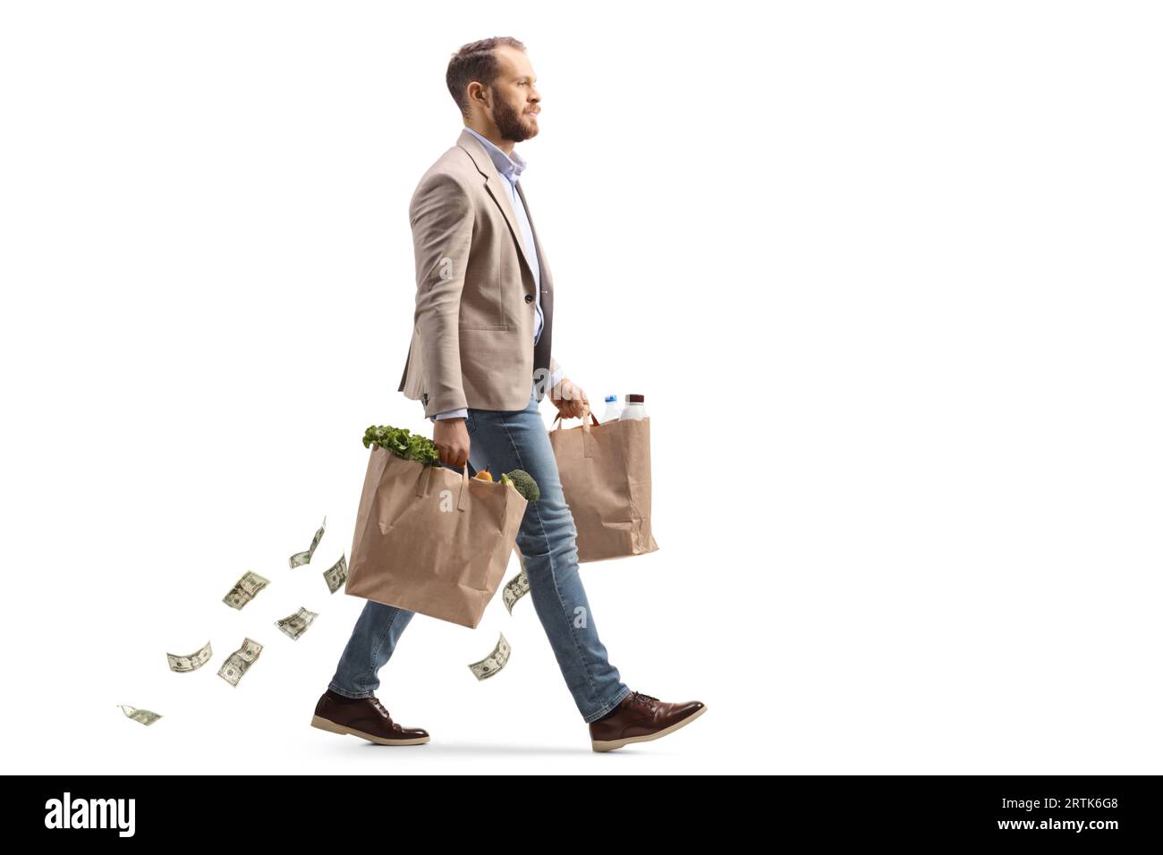 Man walking and carrying groceries and money falling from the bags