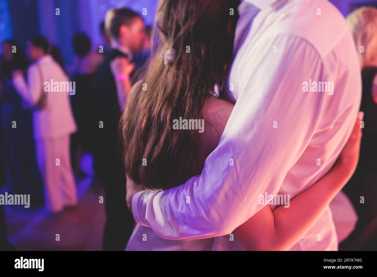 High school graduates dancing waltz and classical ball dance in dresses