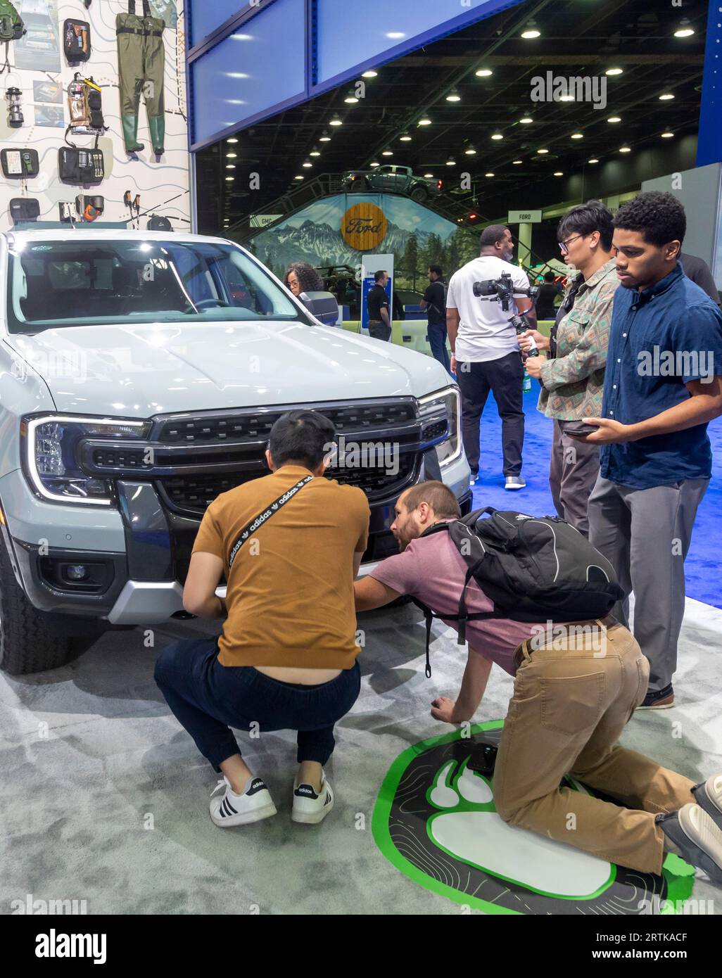 Detroit, Michigan, USA. 13th Sep, 2023. News media members inspect the 2024 Ford Ranger pickup truck on display at the North American International Auto Show. Credit: Jim West/Alamy Live News Stock Photo