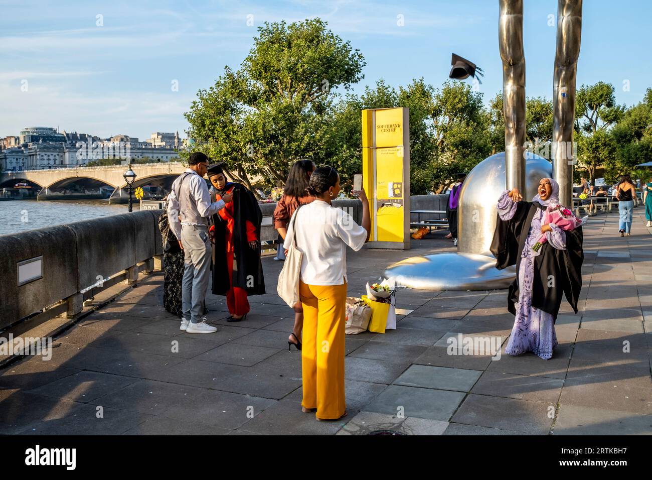 Degree Students Celebrate At Their Graduation Ceremony, The Southbank, London, UK. Stock Photo