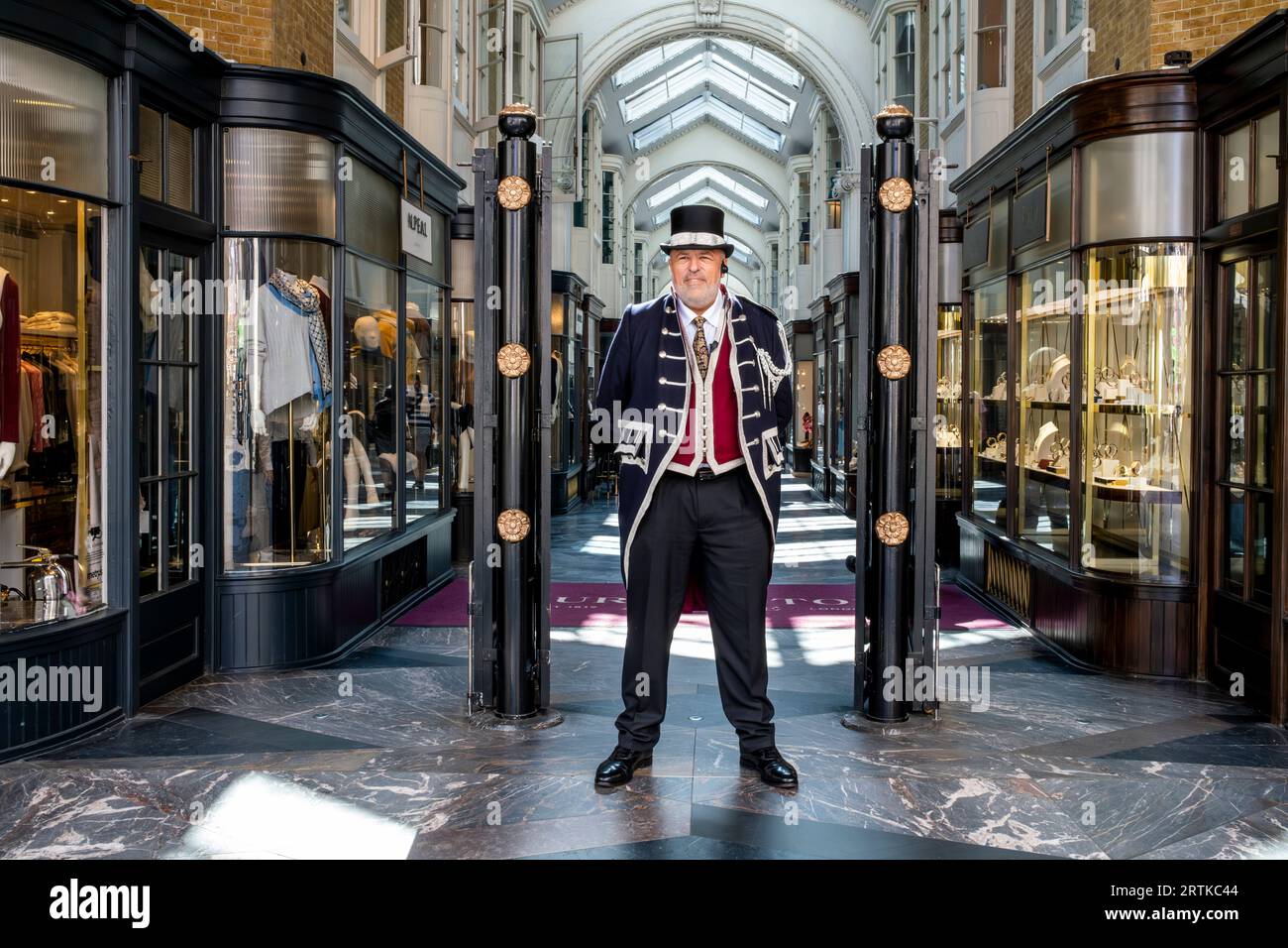 A Beadle Dressed In Traditional Costume Stands At The Entrance Of ...