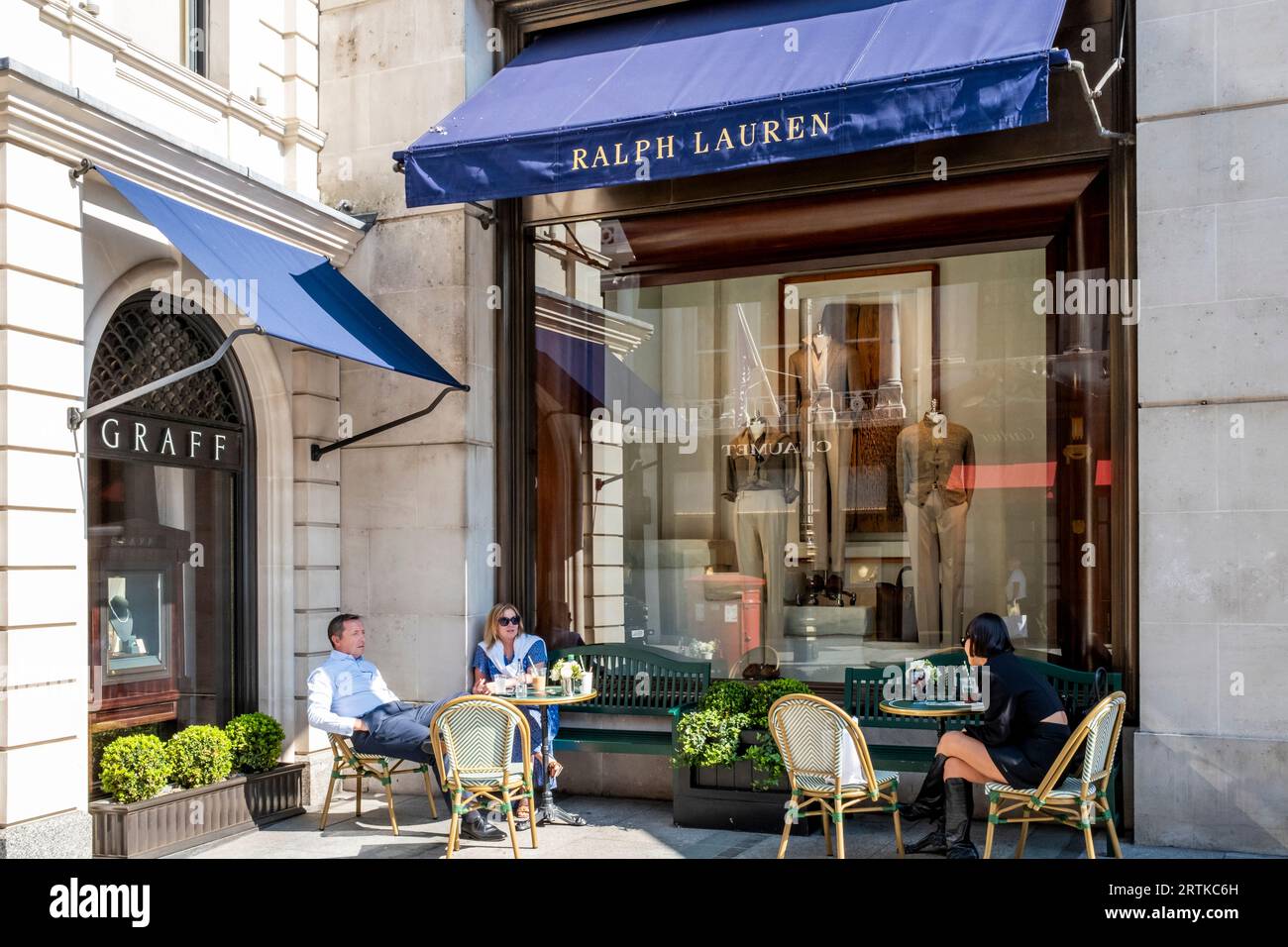People Sitting Outside Ralph's Coffee, New Bond Street, London, UK. Stock Photo
