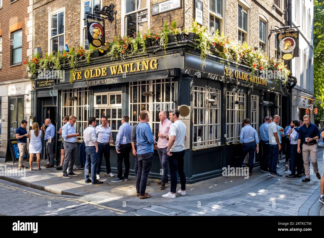 A Group Of Men Drinking Outside Ye Olde Watling Pub, Watling Street,  London, UK. Stock Photo