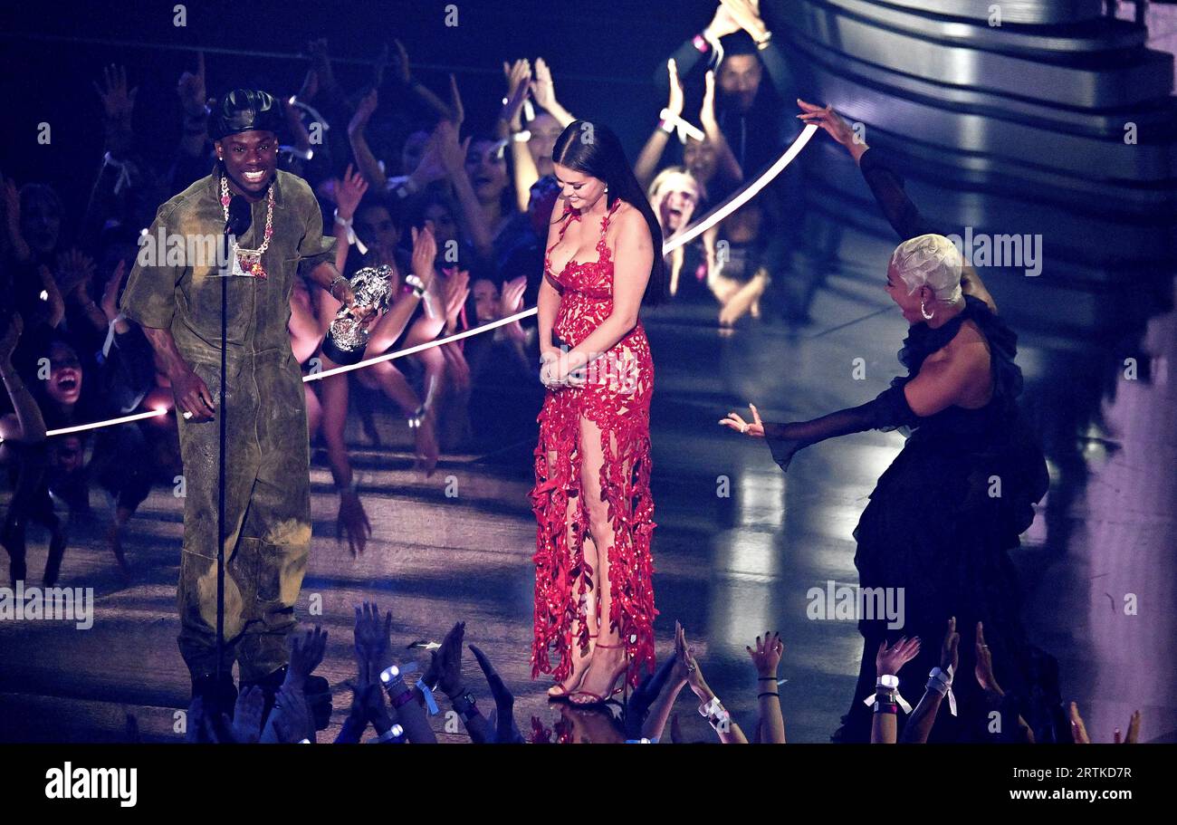 Newark, USA. 12th Sep, 2023. Rema and Selena Gomez accept the Best Afrobeats award for 'Calm Down' onstage, presented by Tiffany Haddish at the 2023 MTV Video Music Awards on September 12, 2023 in Newark, New Jersey. PhotoL Jeremy Smith/imageSPACE Credit: Imagespace/Alamy Live News Stock Photo