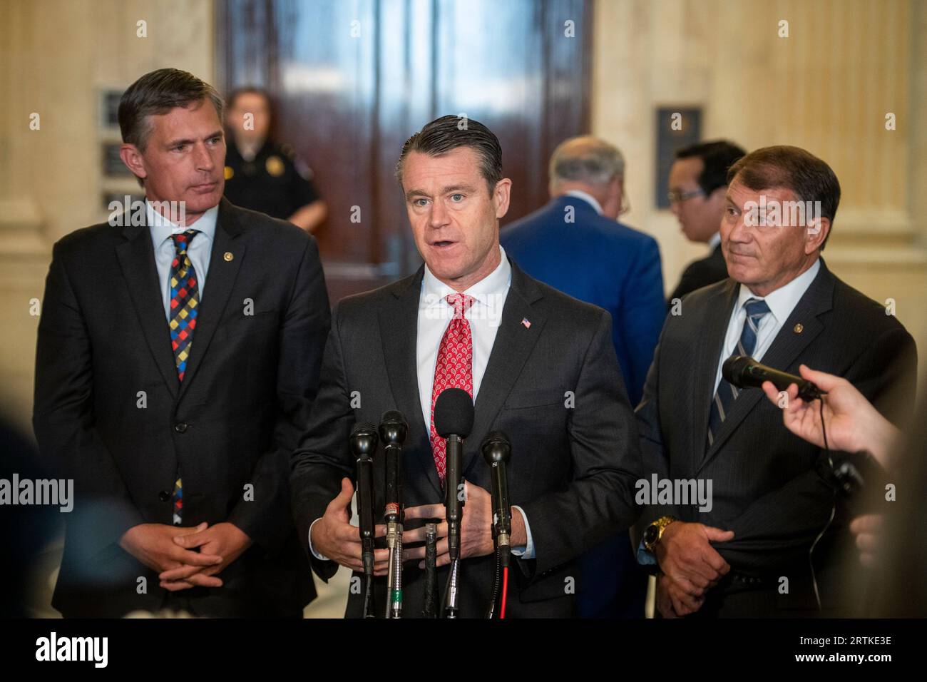 United States Senator Todd Young (Republican of Indiana), center, is flanked by United States Senator Martin Heinrich (Democrat of New Mexico), left, and United States Senator Mike Rounds (Republican of South Dakota), right, as he offers remarks at press briefing during the United States Senate Bipartisan Artificial Intelligence (AI) Forum in the Kennedy Caucus Room on Capitol Hill in Washington, DC on Wednesday, September 13, 2023.Credit: Rod Lamkey/CNP /MediaPunch Stock Photo