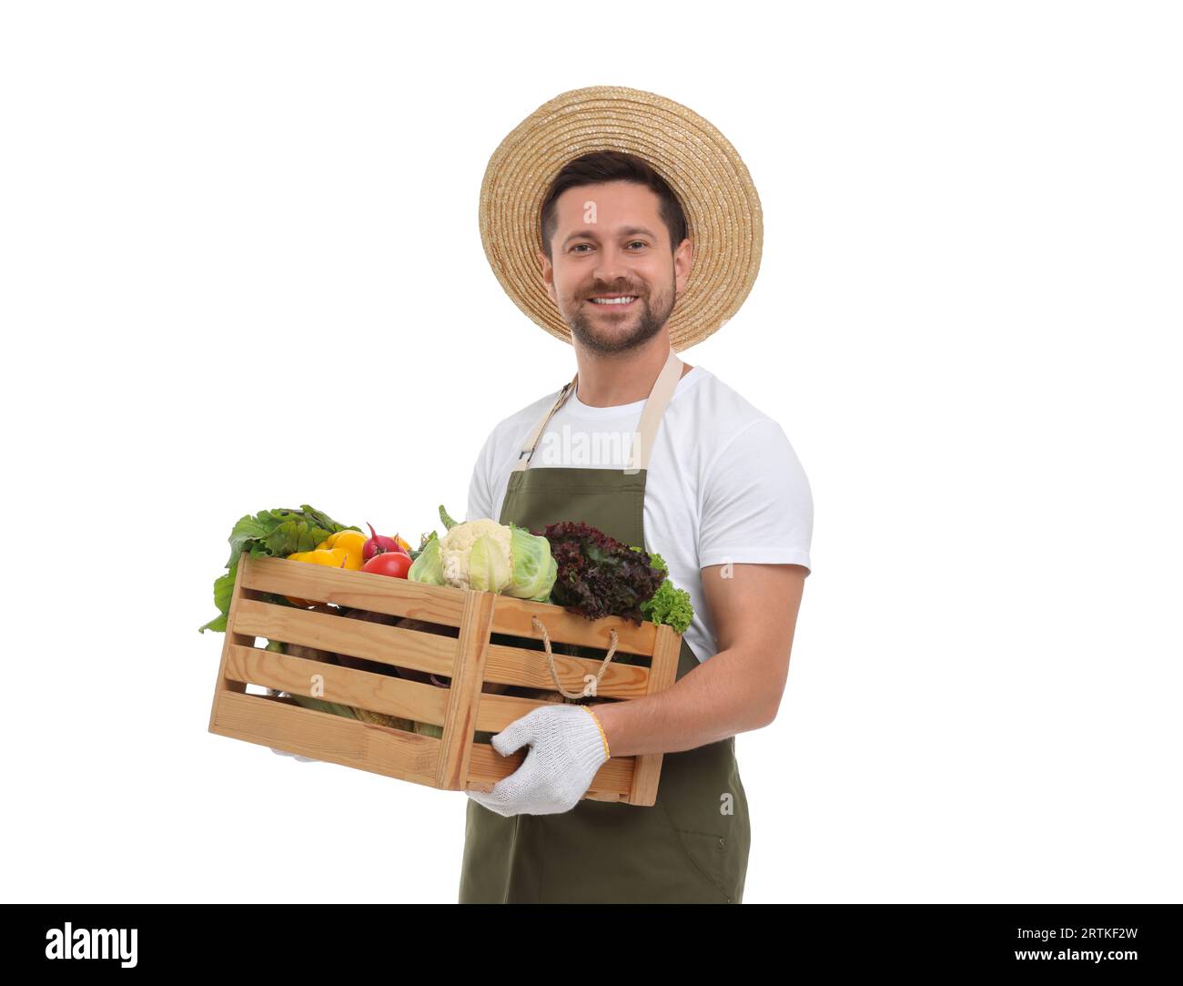 Harvesting season. Happy farmer holding wooden crate with vegetables on ...